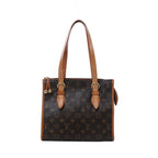 Louis Vuitton Monogram canvas shoulder bag with long tan leather straps, buckle details, gold-tone hardware and decorative zipper pulls.