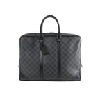 Louis Vuitton Porte Documents Voyages Damier Graphite dark gray checkered briefcase with black leather trim, dual top handles, hanging tag, and zip-top closure on white background