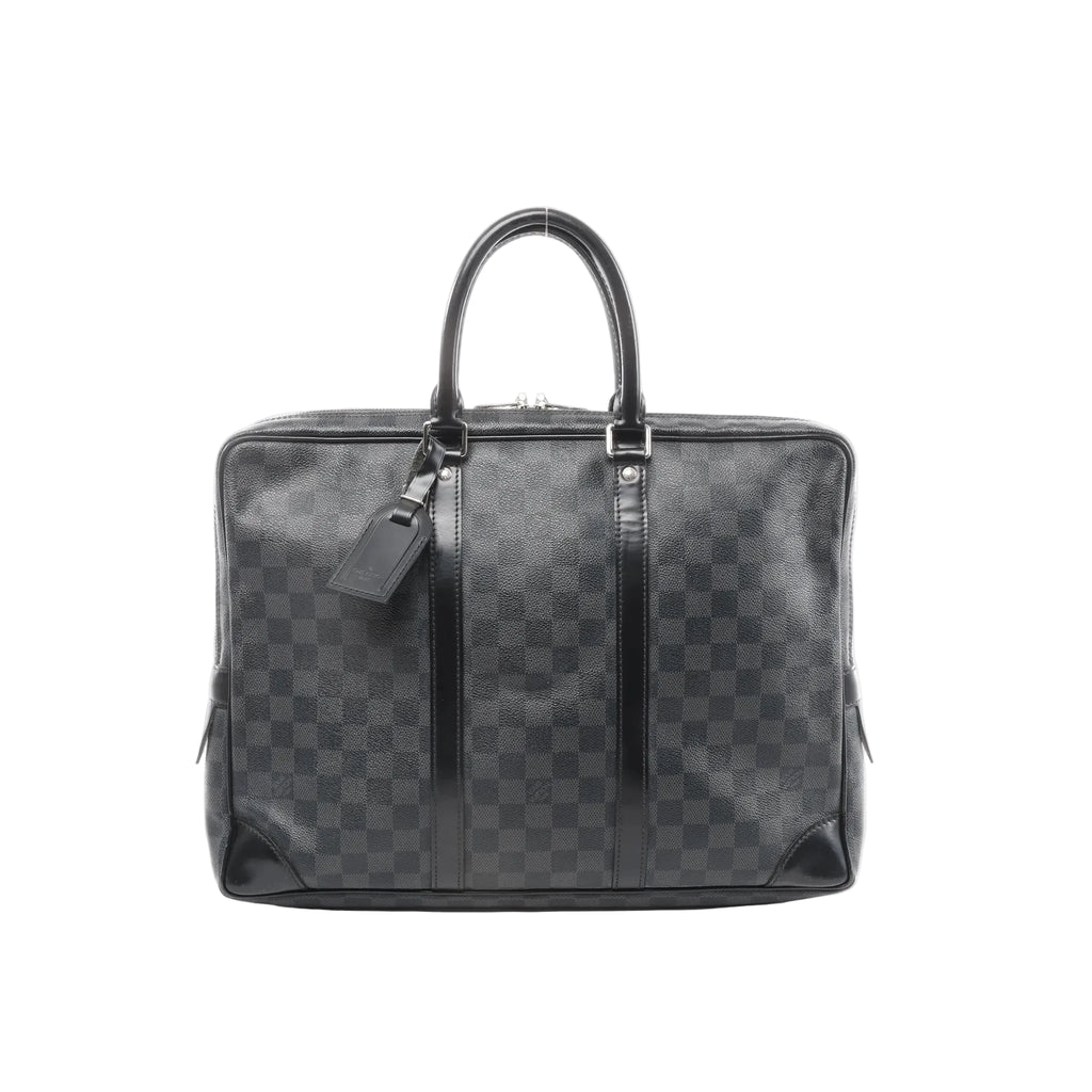 Louis Vuitton Porte-Documents Voyages briefcase in Damier Graphite black check canvas with zip top, black leather trim, top handles, and hanging luggage tag.
