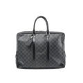 Louis Vuitton Porte-Documents Voyages briefcase in Damier Graphite black check canvas with zip top, black leather trim, top handles, and hanging luggage tag.