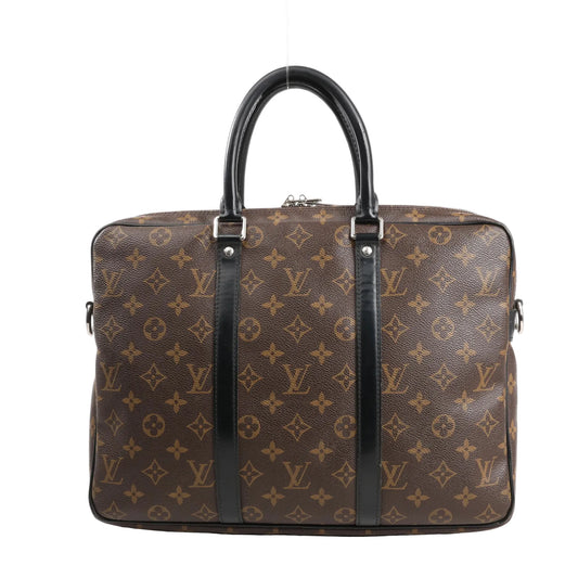 Louis Vuitton Porte-Documents Voyage PM in brown Monogram Macassar canvas, featuring black leather top handles and trim, silver-tone hardware, and a structured, rectangular silhouette ideal for business or travel.