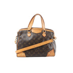 Front view of Louis Vuitton Monogram canvas Retiro PM handbag with tan vachetta leather trim, top handles, gold-tone hardware and detachable shoulder strap on a white background.