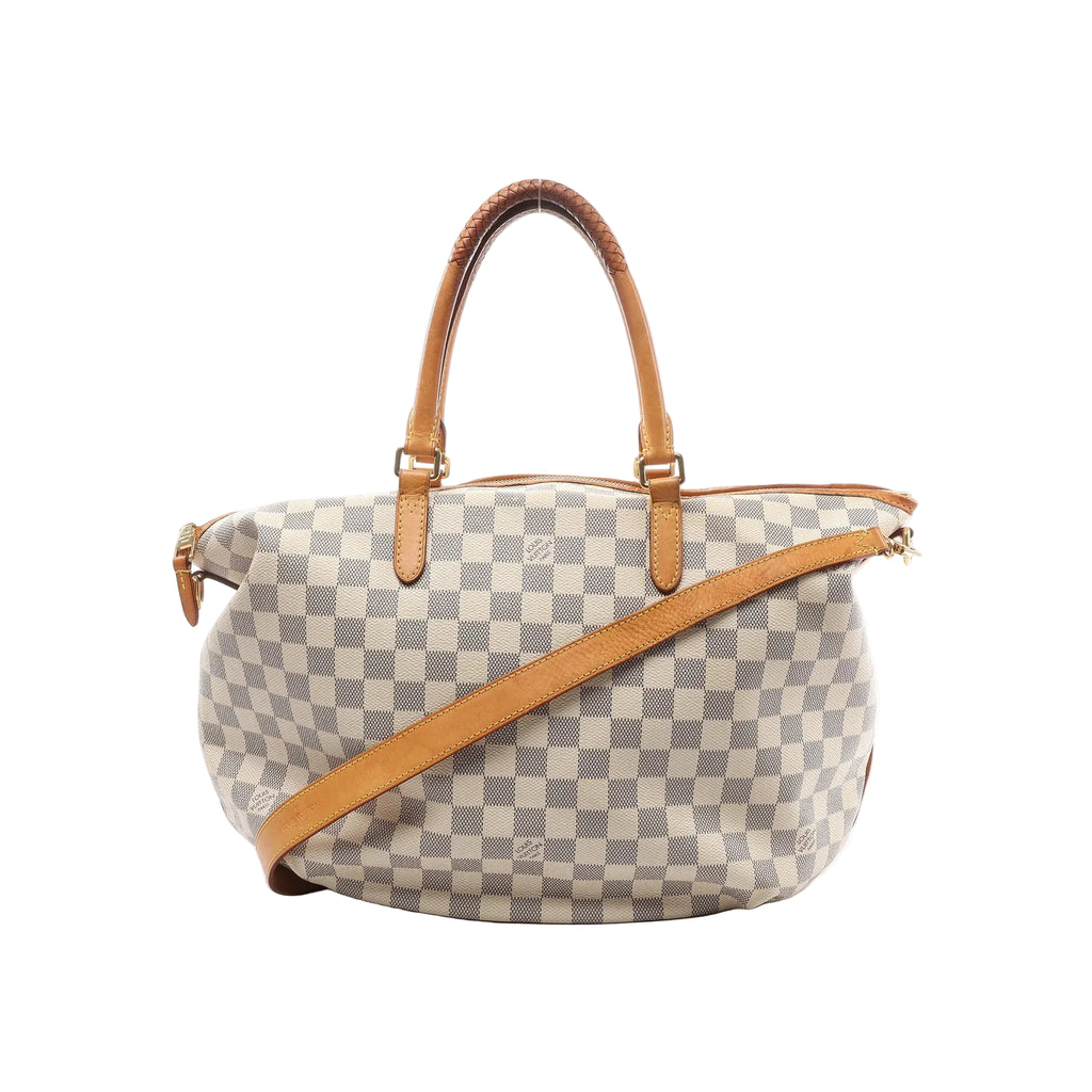 Louis Vuitton Riviera MM Damier Azur 2-way bag in beige checkered canvas with vachetta leather top handles, top zip closure, and a vachetta leather shoulder strap, shown on a white background.