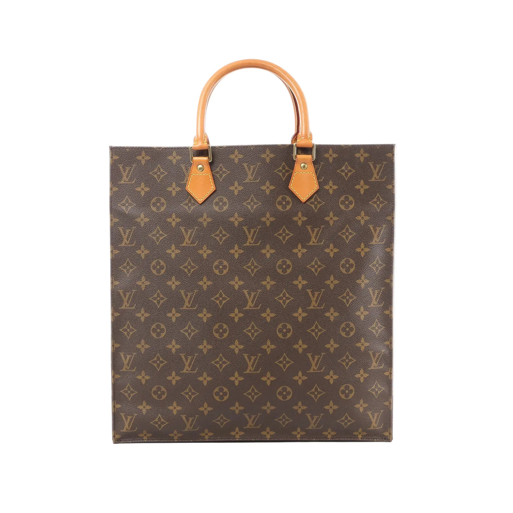 Louis Vuitton Sac Plat tote in brown Monogram canvas with tan leather top handles and gold-tone handle tabs.