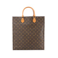 Louis Vuitton Sac Plat tote in brown Monogram canvas with tan leather top handles and gold-tone handle tabs.