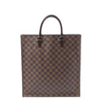 Front view of a tall brown Louis Vuitton Sac Plat tote in Damier Ebene checkered canvas with two dark leather top handles.