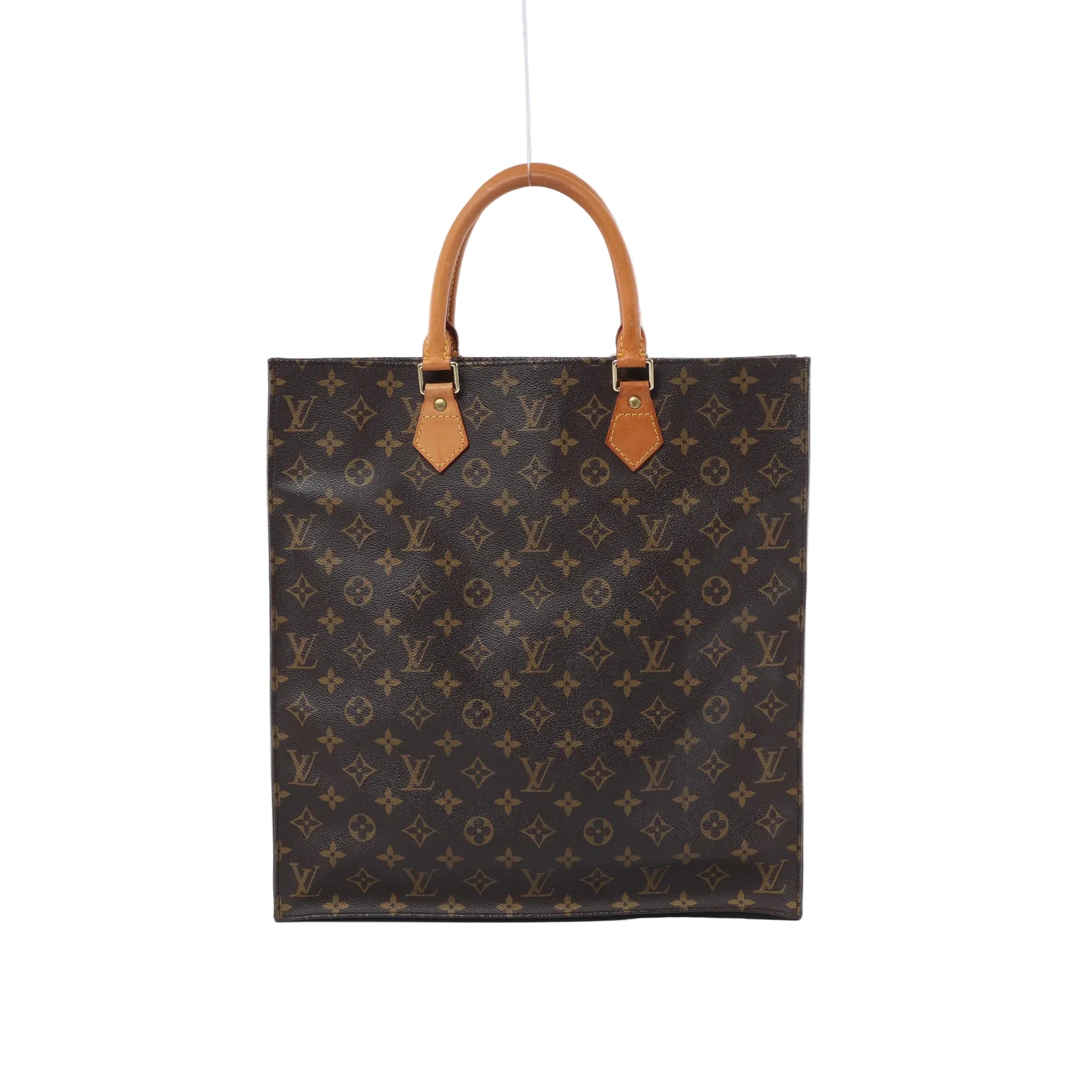 Front view of a tall brown Louis Vuitton Sac Plat Monogram canvas tote bag with two tan leather top handles on a white background.