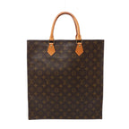 Front view of a brown Louis Vuitton Sac Plat handbag with Monogram canvas, tan rolled leather top handles and gold-tone handle fittings.