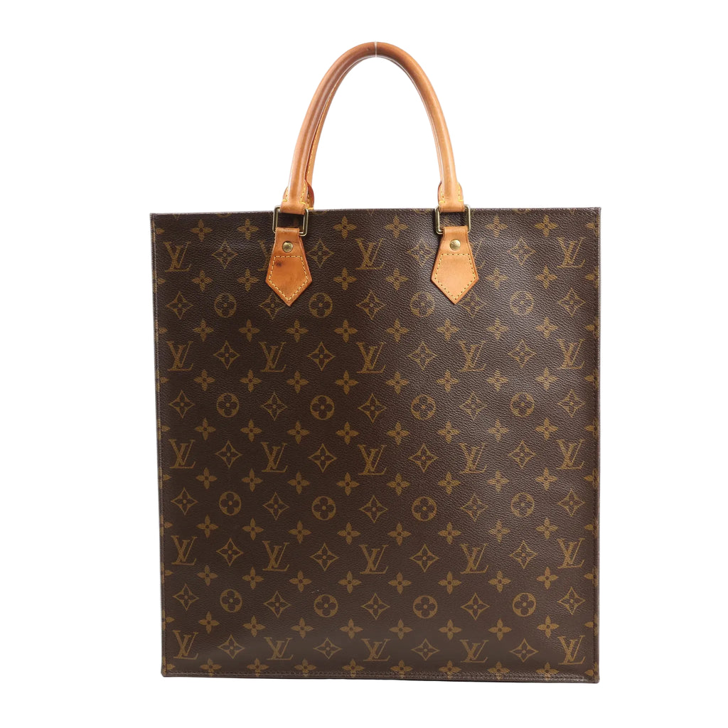 Front view of the Louis Vuitton Sac Plat GM handbag M51140 in brown Monogram canvas, featuring dual natural leather top handles and gold-tone hardware.