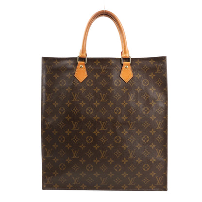 Louis Vuitton Sac Plat GM tote bag M51140 in brown Monogram canvas, featuring a rectangular structured shape, natural leather top handles, and signature LV monogram pattern throughout.