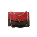 Louis Vuitton Saint Placide crossbody in brown Monogram canvas with red leather flap, gold-tone clasp, and gold chain strap on a white background.