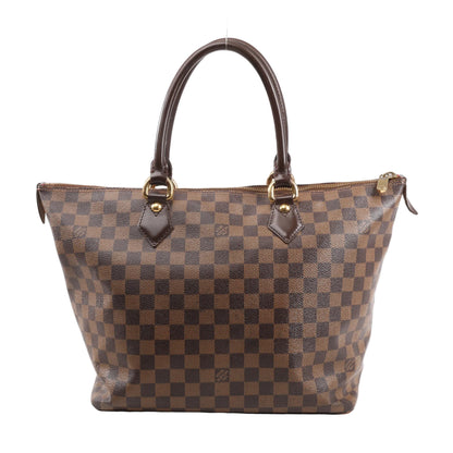 Louis Vuitton Damier Ebene Saleya MM handbag in brown featuring checkered coated canvas, rolled leather handles, and gold-tone hardware.