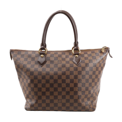 Louis Vuitton Damier Ebene Saleya MM handbag in brown featuring checkered coated canvas, rolled leather handles, and gold-tone hardware.
