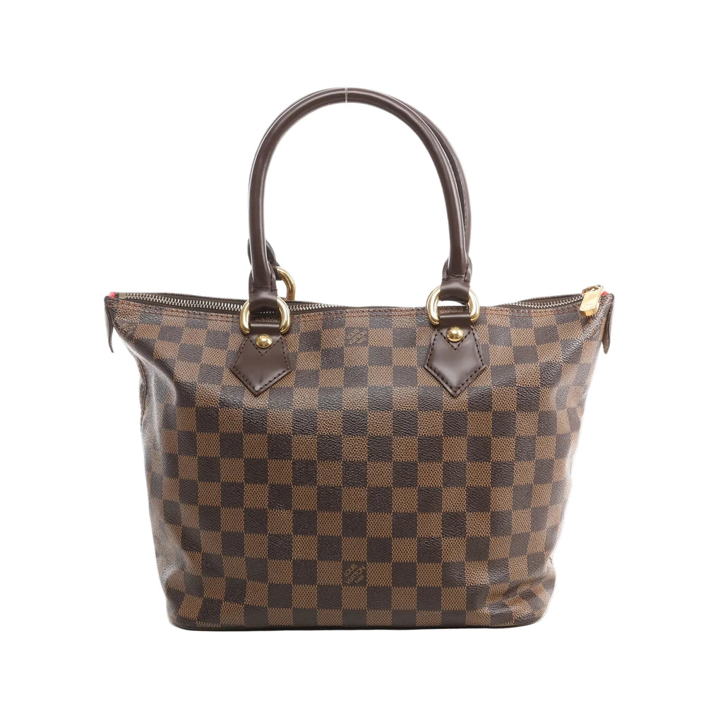 Louis Vuitton Saleya PM brown Damier Ebene checkered tote handbag with two dark leather rolled top handles, gold-tone hardware, and a top zip closure, shown on a white background.