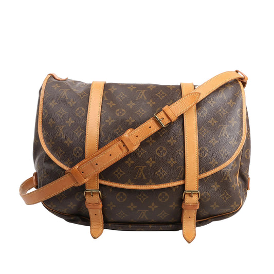 Louis Vuitton Monogram Canvas Saumur 43 Crossbody Bag M42252 featuring brown coated canvas with monogram print, natural Vachetta leather trim, adjustable buckle strap, and saddle-bag silhouette, shown against a white background.