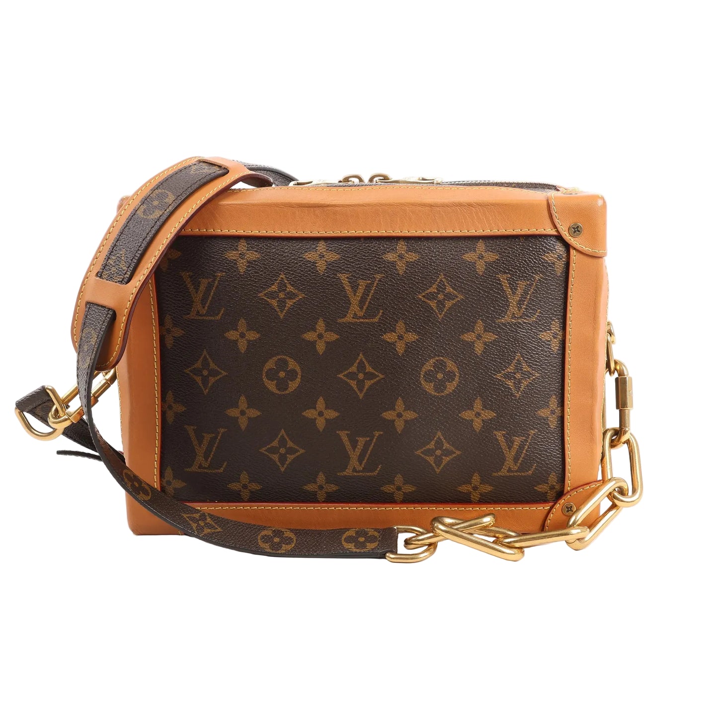 Front view of a Louis Vuitton Soft Trunk crossbody bag in brown Monogram canvas with tan leather trim, gold-tone hardware, and a monogram strap with chunky gold chain links on a white background.