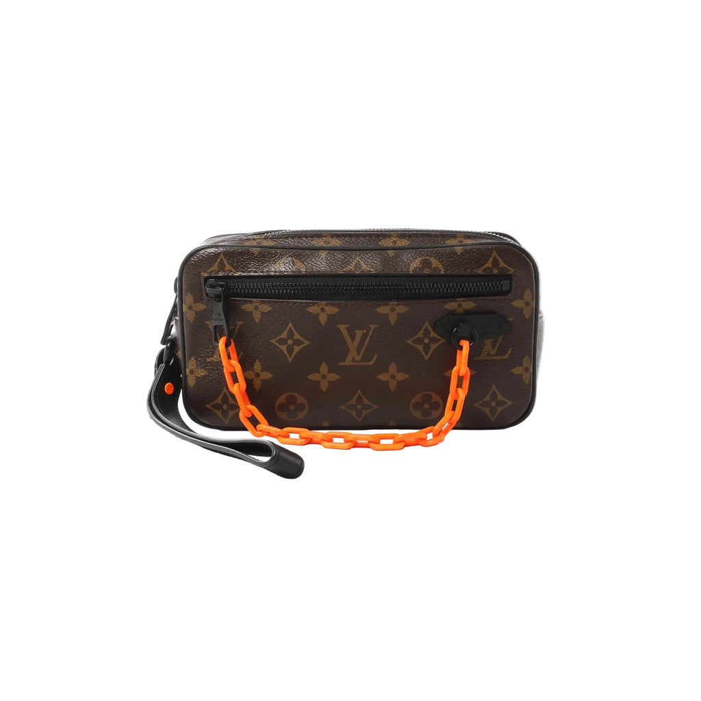 Brown Louis Vuitton Monogram Pochette Volga clutch with black front zip pocket, black leather wrist strap, and neon orange chain handle