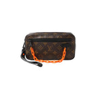 Brown Louis Vuitton Monogram Pochette Volga clutch with black front zip pocket, black leather wrist strap, and neon orange chain handle