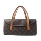 Louis Vuitton Sonatine handbag in brown Monogram canvas with tan leather top handles, curved flap front and red edge detailing.