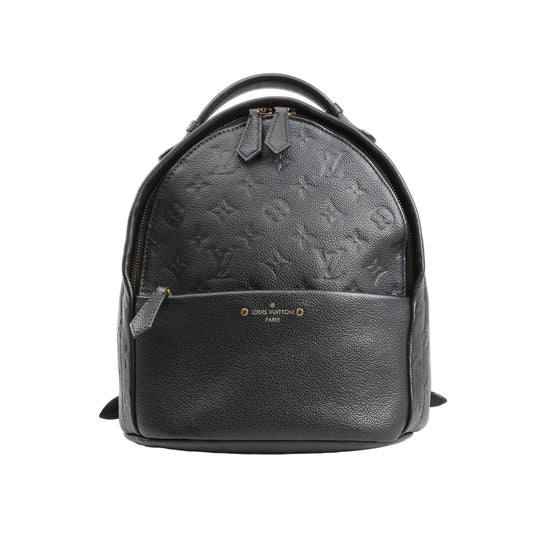 Louis Vuitton Monogram Empreinte Sorbonne Backpack M44016 in black grained leather with embossed monogram pattern, featuring a rounded top, front zip pocket, gold-tone hardware, and top handle, photographed against a white background.