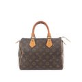 Louis Vuitton Speedy 25 handbag in brown Monogram canvas with tan vachetta leather top handles and top zip closure.