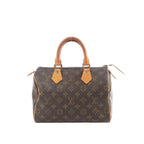 Louis Vuitton Speedy 25 handbag in brown Monogram canvas with tan vachetta leather top handles and top zip closure.