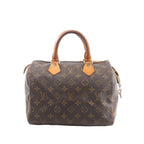 Louis Vuitton Speedy 25 handbag in brown Monogram canvas with tan vachetta leather top handles and zip-top closure, front view on white background.