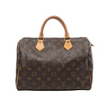 Louis Vuitton Speedy 30 handbag in brown Monogram coated canvas with natural cowhide leather rolled handles, gold-tone hardware, and zip top closure on a white background.