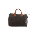 Louis Vuitton Speedy 30 brown Monogram canvas handbag with tan leather top handles, zip-top closure and hanging padlock on white background.