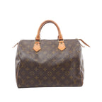 Louis Vuitton Speedy 30 brown Monogram canvas handbag with vachetta leather rolled top handles, vachetta trim, and a top zip closure, shown on a white background.