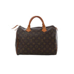 Louis Vuitton Speedy 30 Monogram canvas handbag with tan leather top handles, top zip closure, and brown monogram print on white background