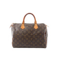 Louis Vuitton Speedy 30 handbag in brown Monogram canvas with tan vachetta leather top handles, top zip closure, and gold-tone hardware.