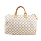 Louis Vuitton Speedy 35 handbag N41535 in beige Damier Azur checkered canvas with natural leather top handles, gold-tone hardware, and structured silhouette.