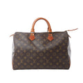 Louis Vuitton Speedy 35 handbag in brown Monogram canvas with natural leather rolled top handles, leather trim and zip-top closure.