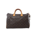 Louis Vuitton Speedy 35 handbag in brown Monogram canvas with tan vachetta leather handles, zip-top closure, leather zipper pulls, and hanging padlock on white background.