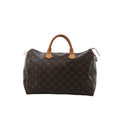 Front view of Louis Vuitton Speedy 35 handbag in brown Monogram canvas with vachetta leather top handles, zip-top closure, and side leather piping.