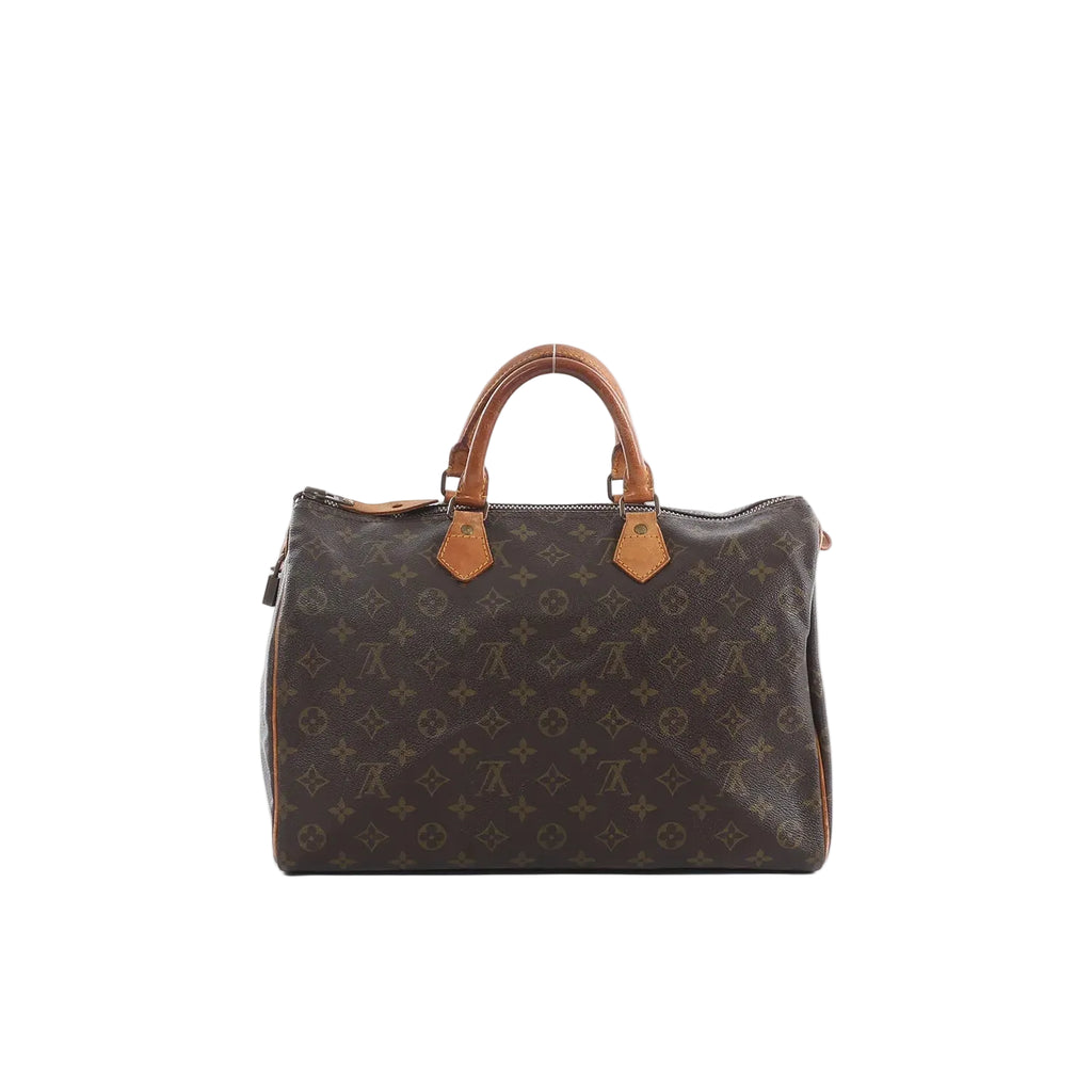 Louis Vuitton Speedy 35 handbag in brown Monogram canvas with tan leather top handles and top zip closure.
