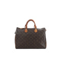 Louis Vuitton Speedy 35 handbag in brown Monogram canvas with tan leather top handles and top zip closure.