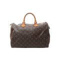 Louis Vuitton Speedy 35 brown Monogram canvas handbag with vachetta leather rolled top handles, vachetta trim, and a top zip closure, shown on a white background.