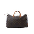 Louis Vuitton Speedy 35 handbag in brown Monogram canvas with tan vachetta leather handles, zip-top closure, and leather zipper pulls on white background.