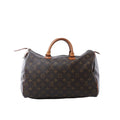 Louis Vuitton Speedy 35 handbag in brown Monogram canvas with tan vachetta leather handles, zip-top closure, and leather zipper pulls on white background.