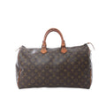 Front view of Louis Vuitton Speedy 40 handbag in brown Monogram canvas with vachetta leather top handles, zip-top closure, and brown leather trim.
