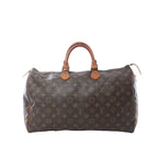 Front view of Louis Vuitton Speedy 40 handbag in brown Monogram canvas with vachetta leather top handles, zip-top closure, and brown leather trim.