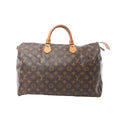 Front view of Louis Vuitton Speedy 40 Monogram canvas handbag with vachetta leather top handles and zip-top closure on a white background.