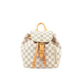Louis Vuitton Sperone BB mini backpack in beige Damier Azur check canvas with tan leather top handle and trim, buckle-front flap, and side zip pocket.