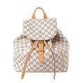 Louis Vuitton Sperone backpack in cream and grey Damier Azur canvas with tan leather trim, flap closure, drawstrings and side zip pocket.