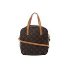 Brown Louis Vuitton Spontini Monogram canvas handbag with tan leather top handles, slim shoulder strap, rounded top and gold-tone hardware.