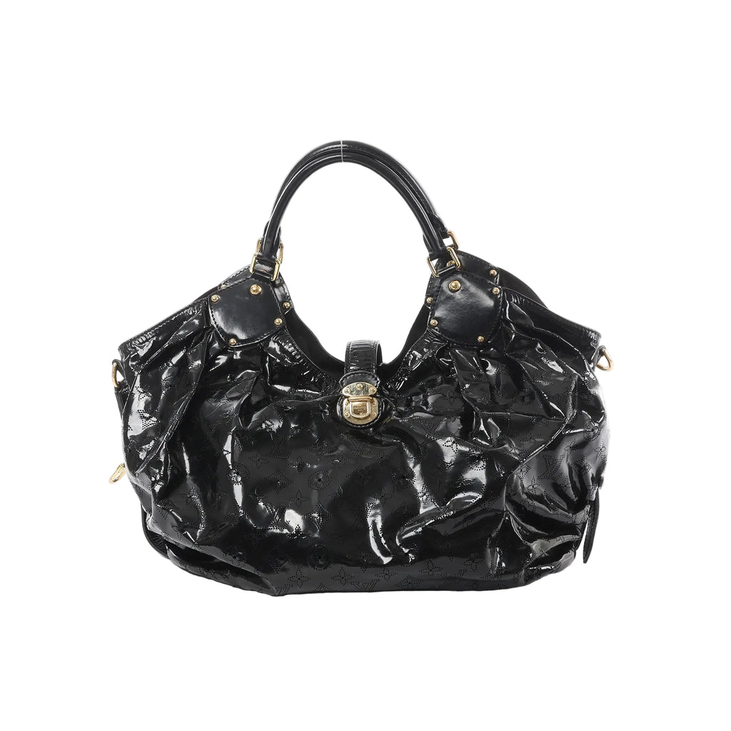 Front view of Louis Vuitton Surya XL bag in black patent Mahina leather with perforated Monogram pattern, ruched body, dual top handles with stud accents, and gold-tone clasp closure.