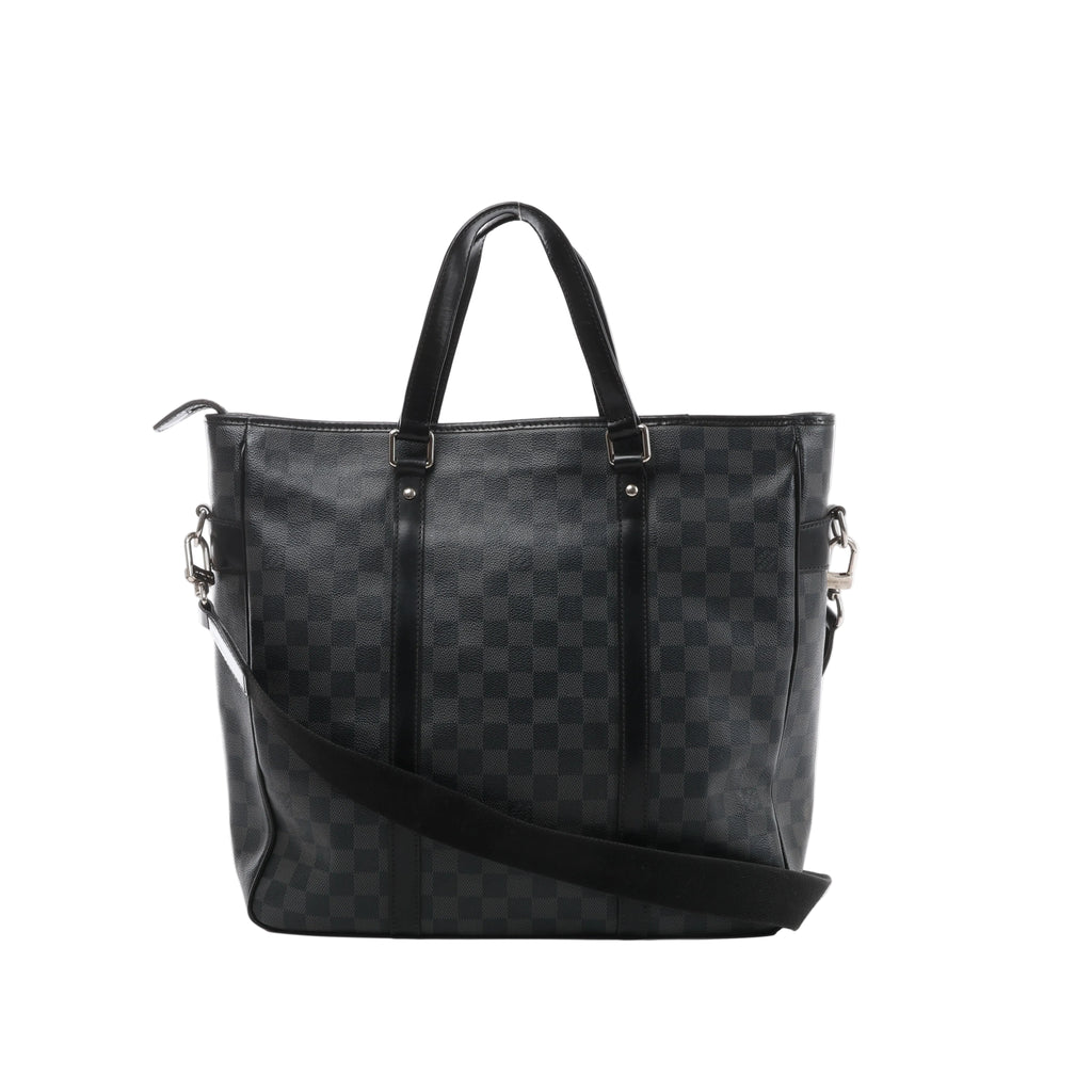 A black and grey Louis Vuitton Tadao 2Way tote bag in Damier Graphite canvas, featuring black leather top handles, side strap attachments, and silver-tone hardware.