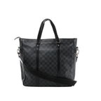 A black and grey Louis Vuitton Tadao 2Way tote bag in Damier Graphite canvas, featuring black leather top handles, side strap attachments, and silver-tone hardware.